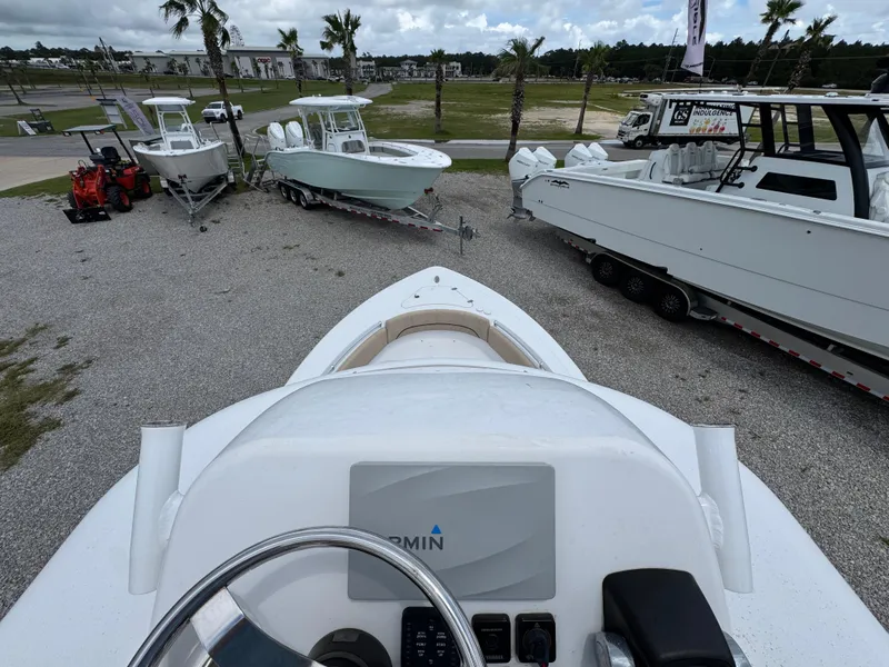 Slide: The Image of 2020 Sportsman Open 282TE Center Console boat on display with other boats nearby. - 35