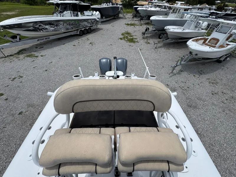 Slide: The Image of 2020 Sportsman Open 282TE Center Console boat in a lot with other boats. - 37