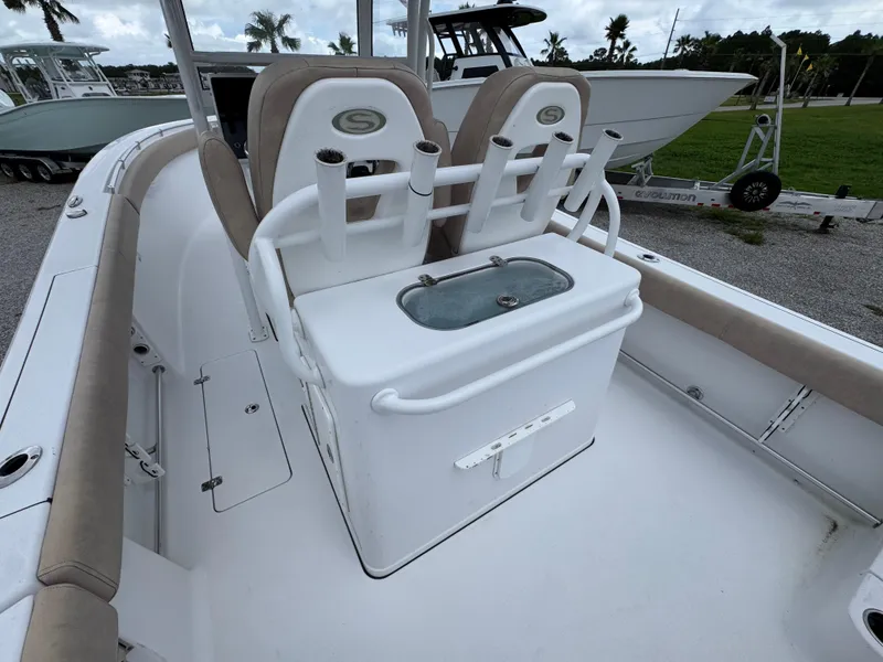 Slide: The Image of 2020 Sportsman Open 282TE Center Console boat interior with seating and storage. - 38