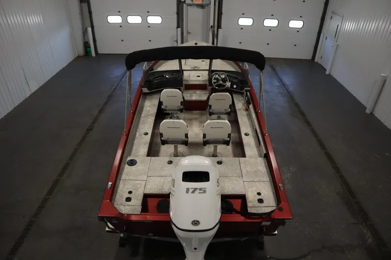 Slide: The Image of 2023 Polar Kraft 2010 OUTLANDER DC boat in a garage, interior view. - 10