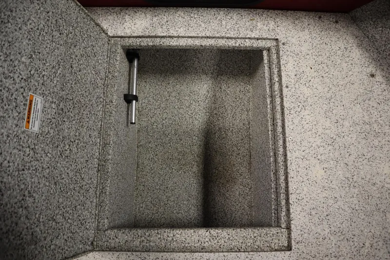 Slide: The Image of Storage compartment in 2023 Polar Kraft 2010 OUTLANDER DC boat, featuring a textured interior. - 15
