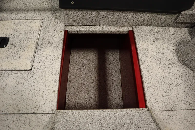 Slide: The Image of Open storage compartment on 2023 Polar Kraft 2010 OUTLANDER DC boat deck. - 17