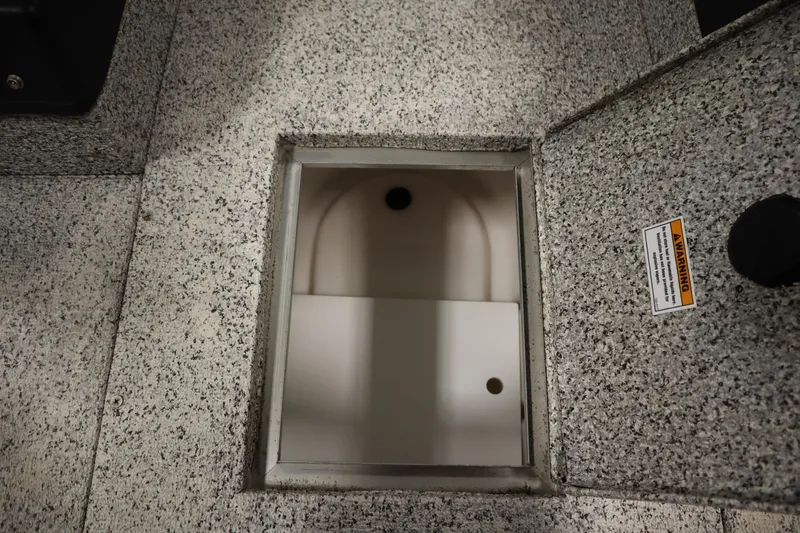 Slide: The Image of Open storage compartment on 2023 Polar Kraft 2010 OUTLANDER DC boat deck. - 19