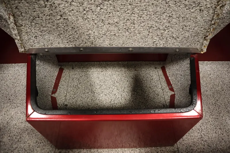 Slide: The Image of Open storage compartment in 2023 Polar Kraft 2010 OUTLANDER DC boat, featuring red and gray interior. - 26