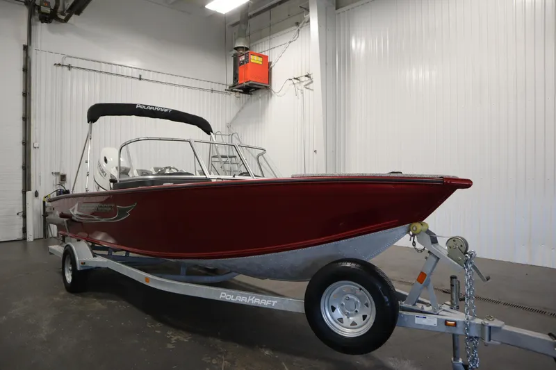 Slide: The Image of 2023 Polar Kraft 2010 OUTLANDER DC boat on trailer in indoor storage. - 3