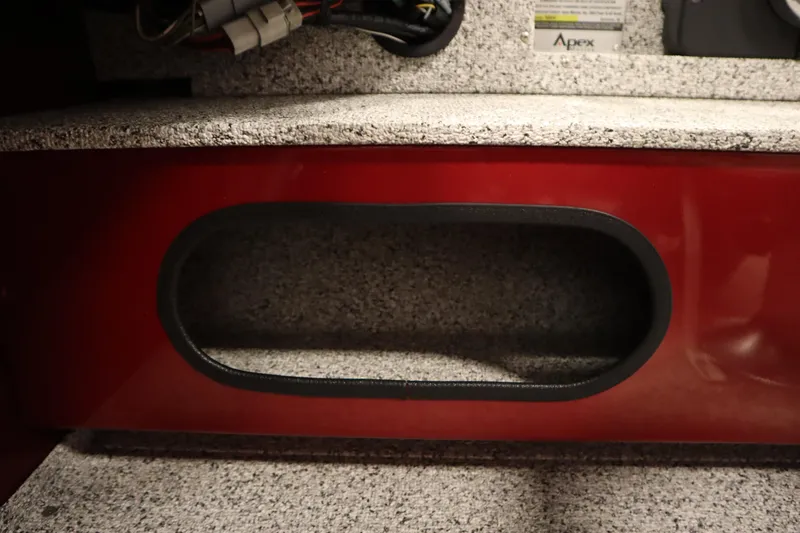 Slide: The Image of Interior detail of 2023 Polar Kraft 2010 Outlander DC boat, featuring storage compartment. - 33