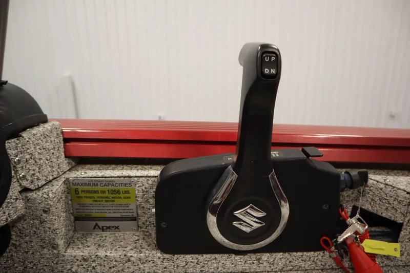 Slide: The Image of Throttle control of 2023 Polar Kraft 2010 OUTLANDER DC boat, showing capacity label and keys. - 34