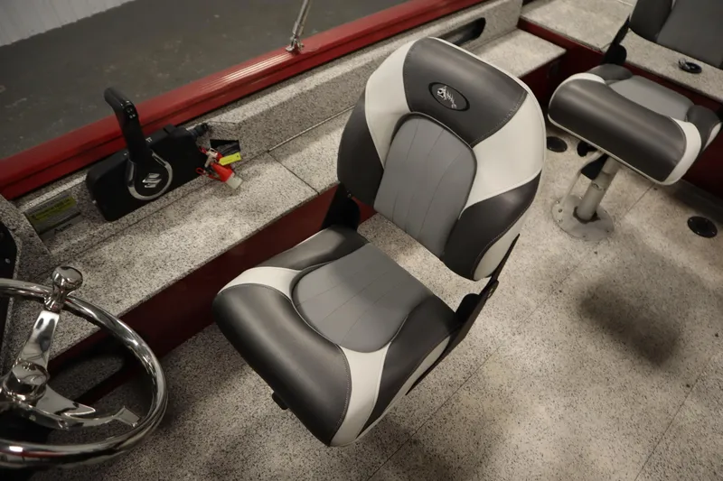 Slide: The Image of Interior of 2023 Polar Kraft 2010 Outlander DC boat with steering wheel and seats. - 35