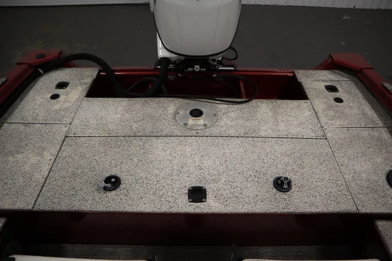 Slide: The Image of 2023 Polar Kraft 2010 Outlander DC boat deck with motor, featuring storage compartments. - 47