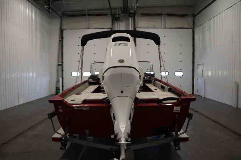 Slide: The Image of Polar Kraft 2010 Outlander DC boat in garage, rear view, 2023 model. - 6