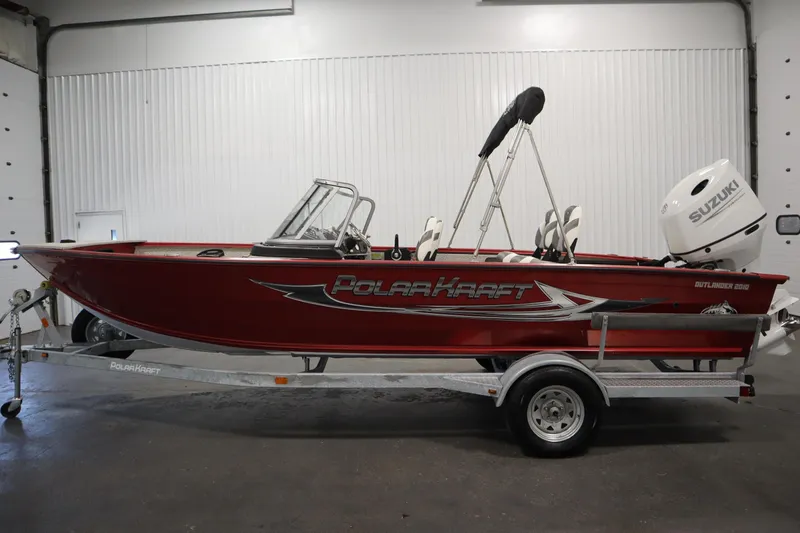 Slide: The Image of Red 2023 Polar Kraft 2010 OUTLANDER DC boat with Suzuki outboard motor on trailer. - 8
