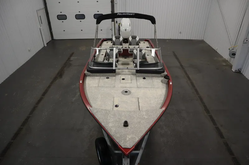 Slide: The Image of 2023 Polar Kraft 2010 OUTLANDER DC boat in indoor storage facility. - 9