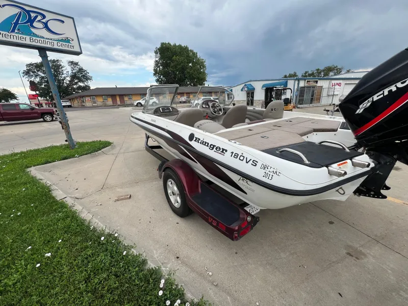 Slide: The Image of 2004 Ranger 180 Reata boat at Premier Boating Center, parked on a trailer. - 3