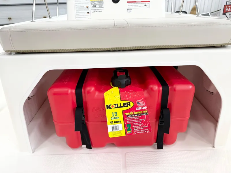 Slide: The Image of Red Moeller fuel tank under seat of 2025 Boston Whaler 150 Montauk boat. - 9