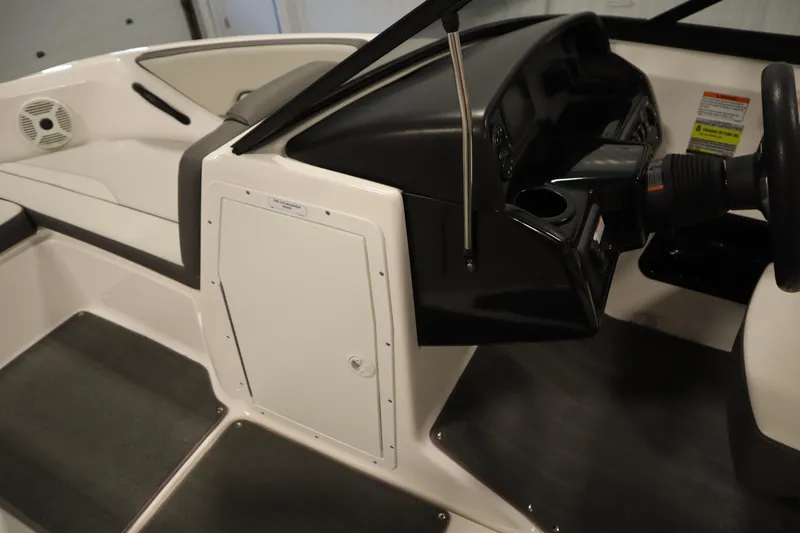 Slide: The Image of Interior view of 2021 Yamaha Boats 190 AR, showcasing steering console and seating area. - 15