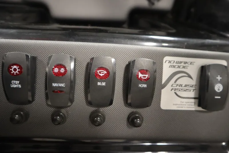 Slide: The Image of Control panel of a 2021 Yamaha Boats 190 AR with various switches and labels. - 21