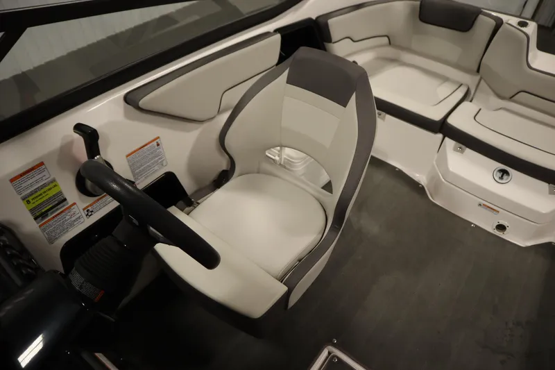 Slide: The Image of 2021 Yamaha Boats 190 AR interior with steering wheel and seating area. - 24