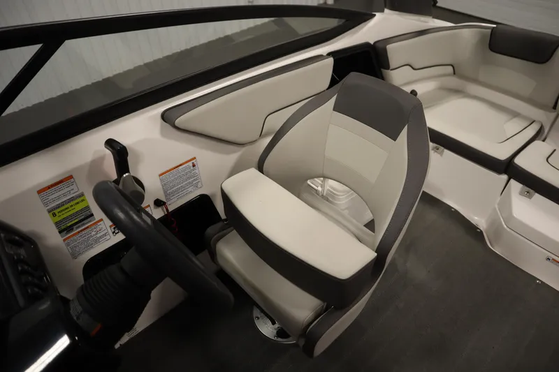 Slide: The Image of Interior of 2021 Yamaha Boats 190 AR, featuring steering wheel and seating. - 25