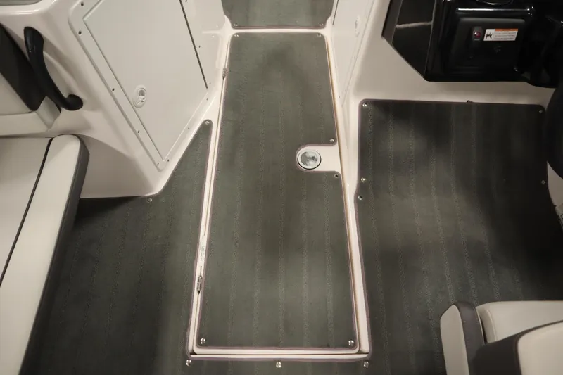 Slide: The Image of Interior view of 2021 Yamaha Boats 190 AR, featuring sleek flooring and seating. - 26