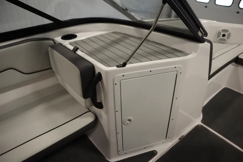 Slide: The Image of Interior of 2021 Yamaha Boats 190 AR, featuring seating and storage compartment. - 28
