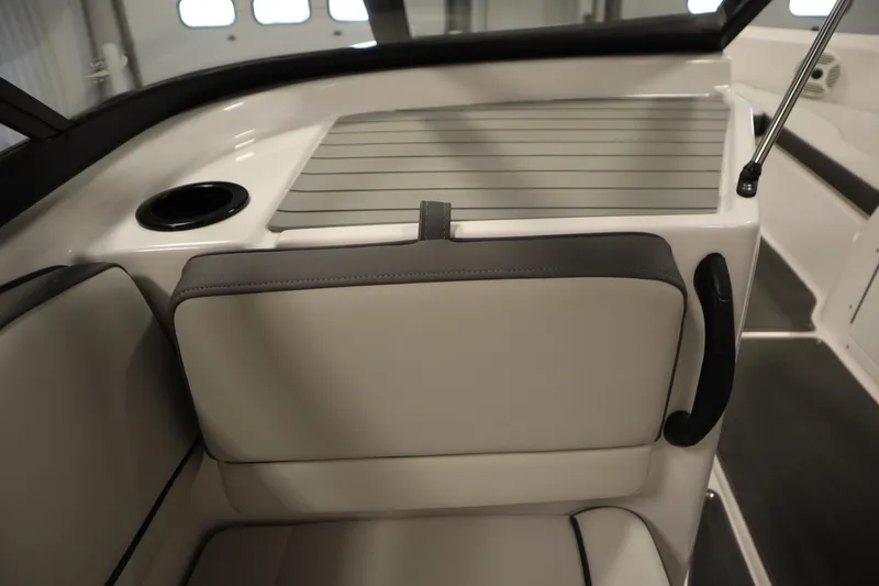 Slide: The Image of Interior of 2021 Yamaha Boats 190 AR, featuring seating and cup holder. - 30