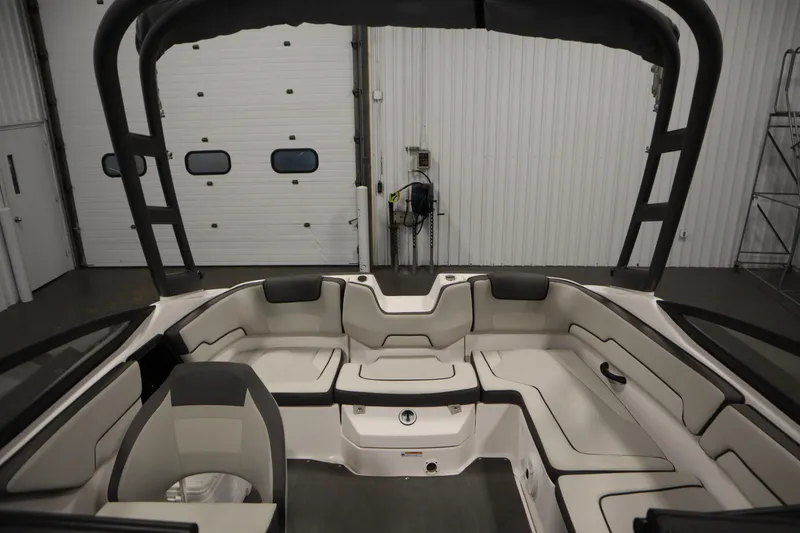 Slide: The Image of 2021 Yamaha Boats 190 AR interior with spacious seating and sleek design. - 32