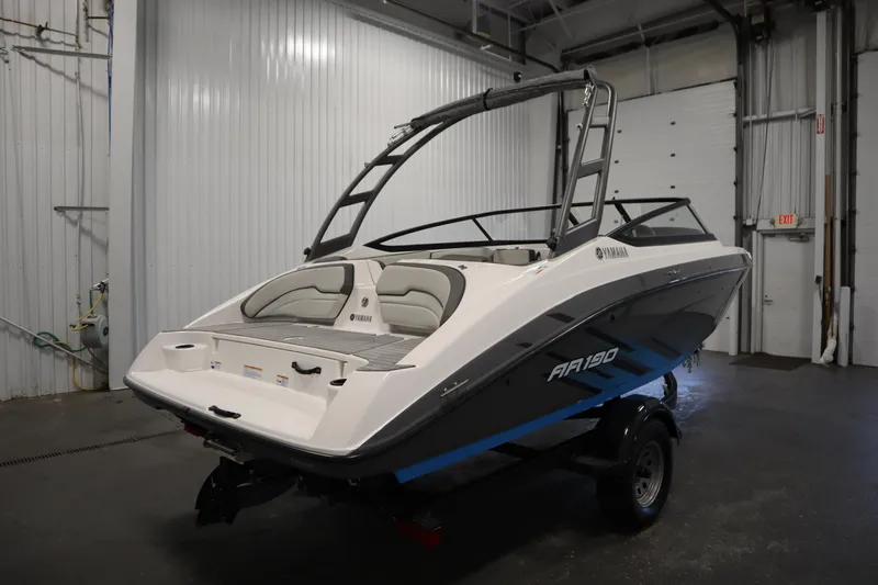 Slide: The Image of 2021 Yamaha Boats 190 AR in a garage, showcasing sleek design and modern features. - 5