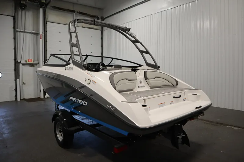 Slide: The Image of 2021 Yamaha Boats 190 AR in a garage, showcasing sleek design and modern features. - 7