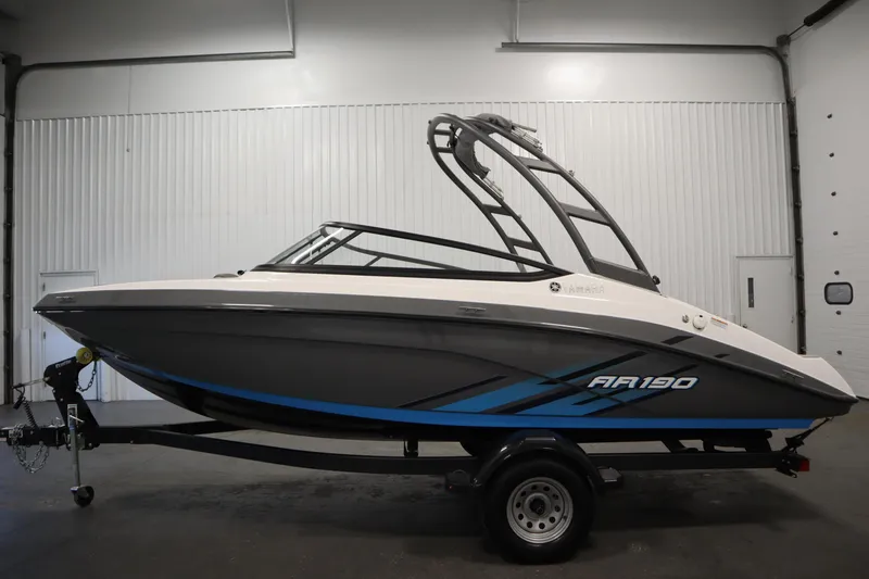 Slide: The Image of 2021 Yamaha Boats 190 AR in a showroom, featuring sleek design and modern graphics. - 8