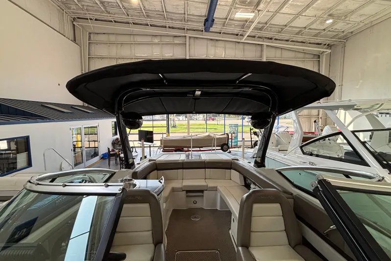 Slide: The Image of Interior of 2013 Sea Ray 270 SLX boat, featuring sleek seating and modern dashboard. - 11