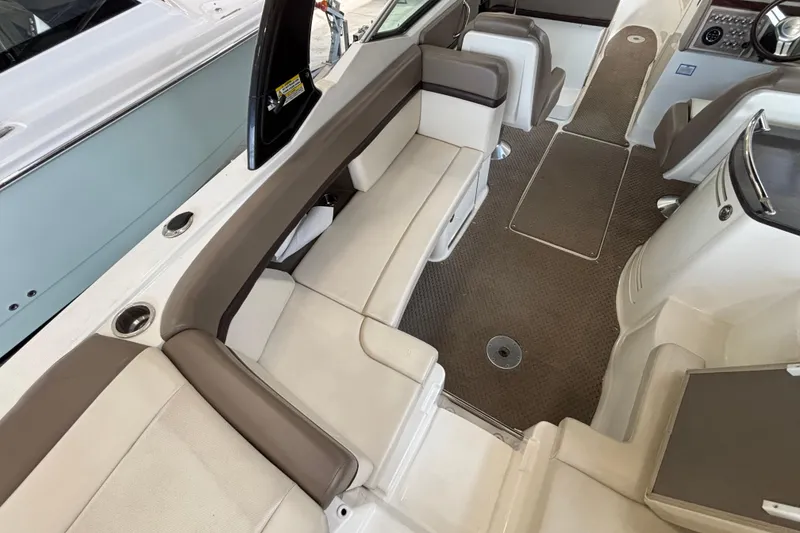 Slide: The Image of 2013 Sea Ray 270 SLX boat interior with open storage compartments. - 15
