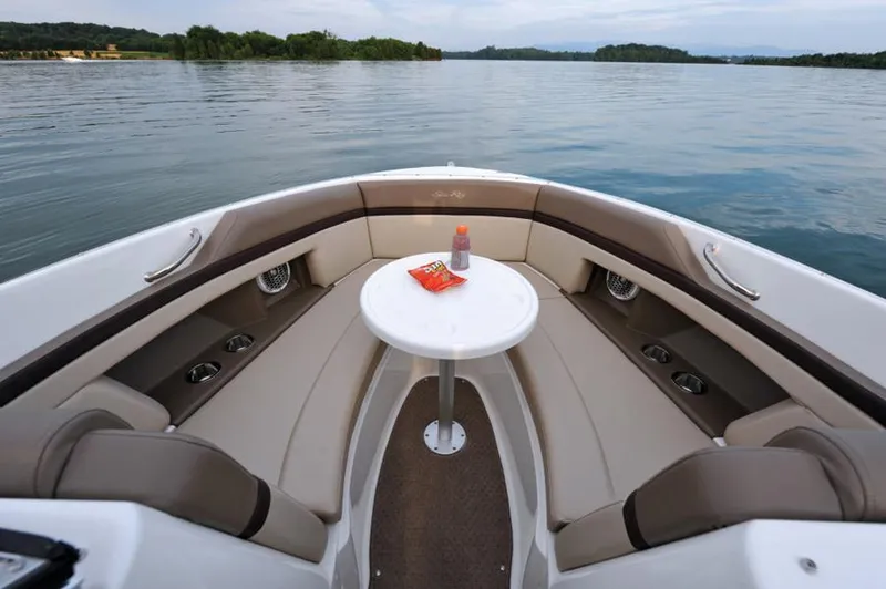 Slide: The Image of 2013 Sea Ray 270 SLX boat cockpit with steering wheel and control panel. - 2