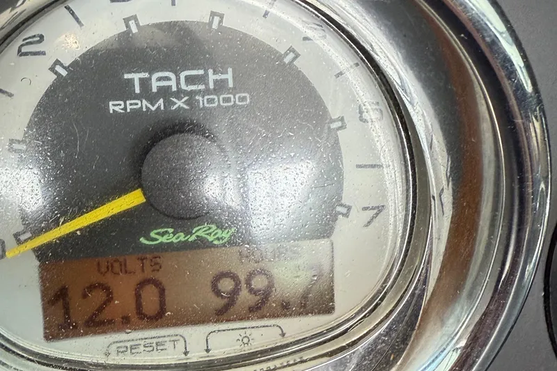 Slide: The Image of 2013 Sea Ray 270 SLX boat on trailer, parked outdoors under clear sky. - 5