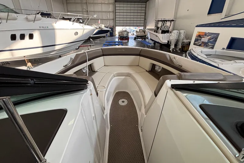 Slide: The Image of Interior view of a 2013 Sea Ray 270 SLX boat in a storage facility. - 9
