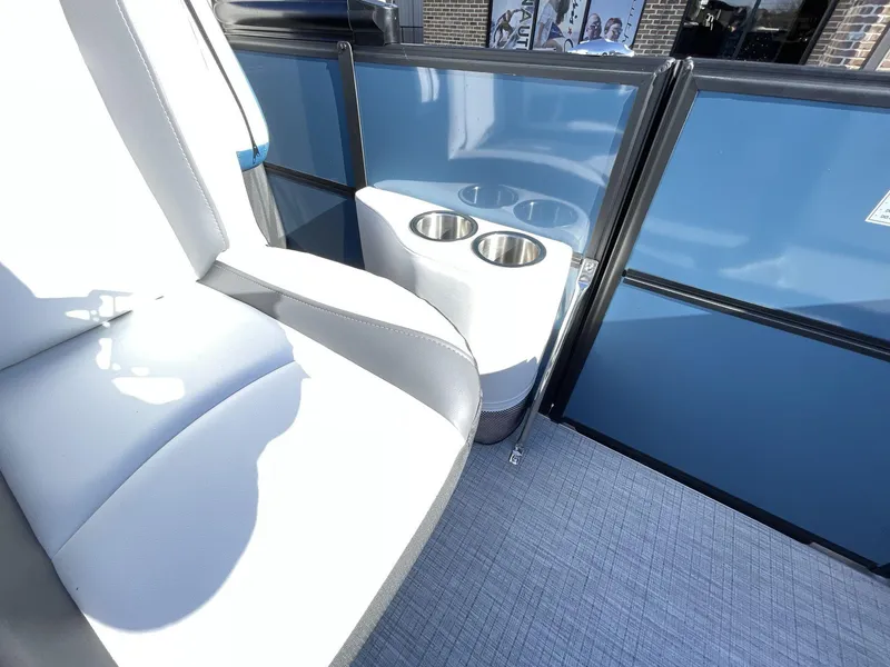 Slide: The Image of 2025 South Bay S222 RS boat interior with blue paneling and cup holders. - 16