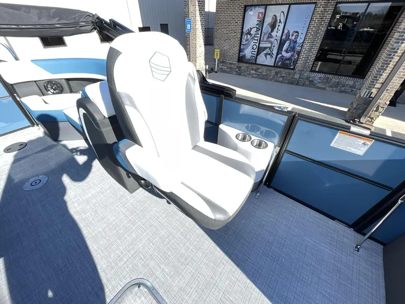 Slide: The Image of 2025 South Bay S222 RS boat interior with white seating and cup holders. - 17