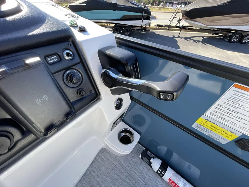 Slide: The Image of Control panel of 2025 South Bay S222 RS boat with throttle and switches. - 19