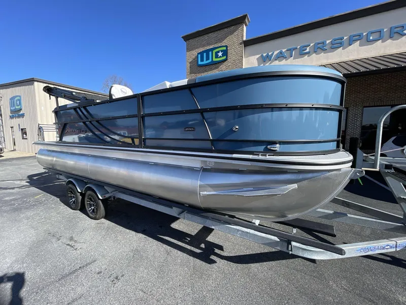 Slide: The Image of 2025 South Bay S222 RS pontoon boat on trailer at dealership. - 26