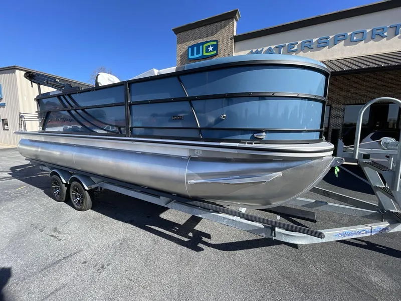 Slide: The Image of 2025 South Bay S222 RS pontoon boat on trailer outside dealership. - 9