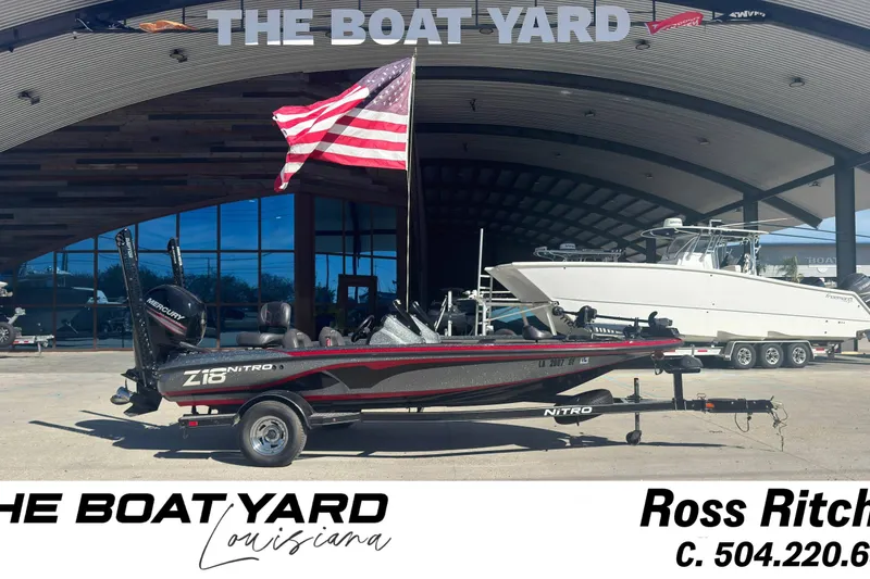 Slide: The Image of 2016 Nitro Z18 boat at The Boat Yard, Louisiana, with American flag. - 10