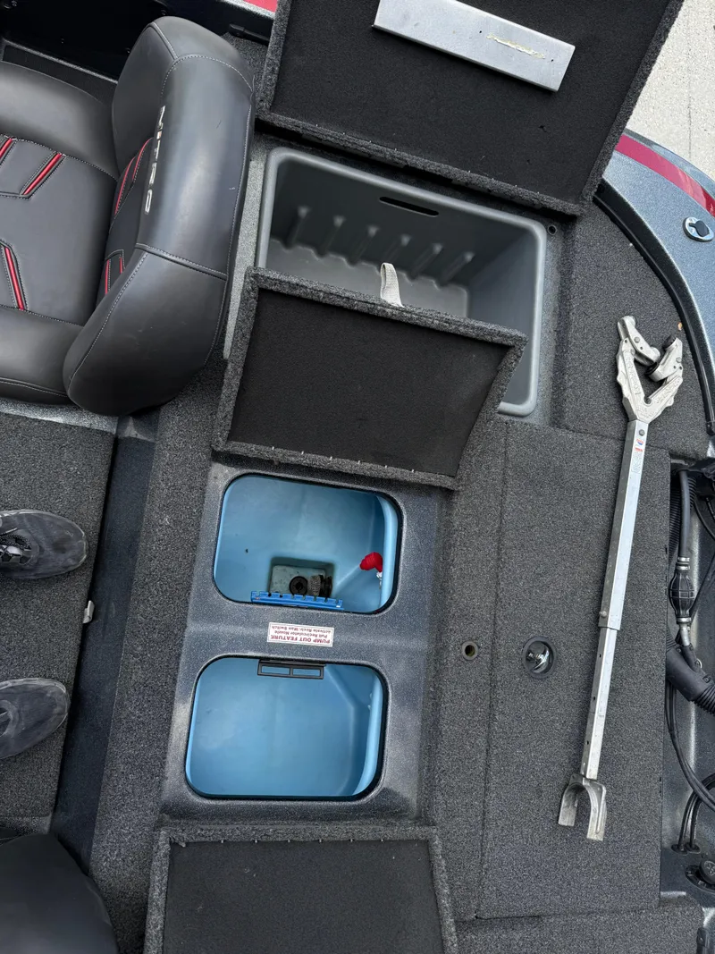 Slide: The Image of Interior of a 2016 Nitro Z18 boat showing storage compartments and seating. - 15