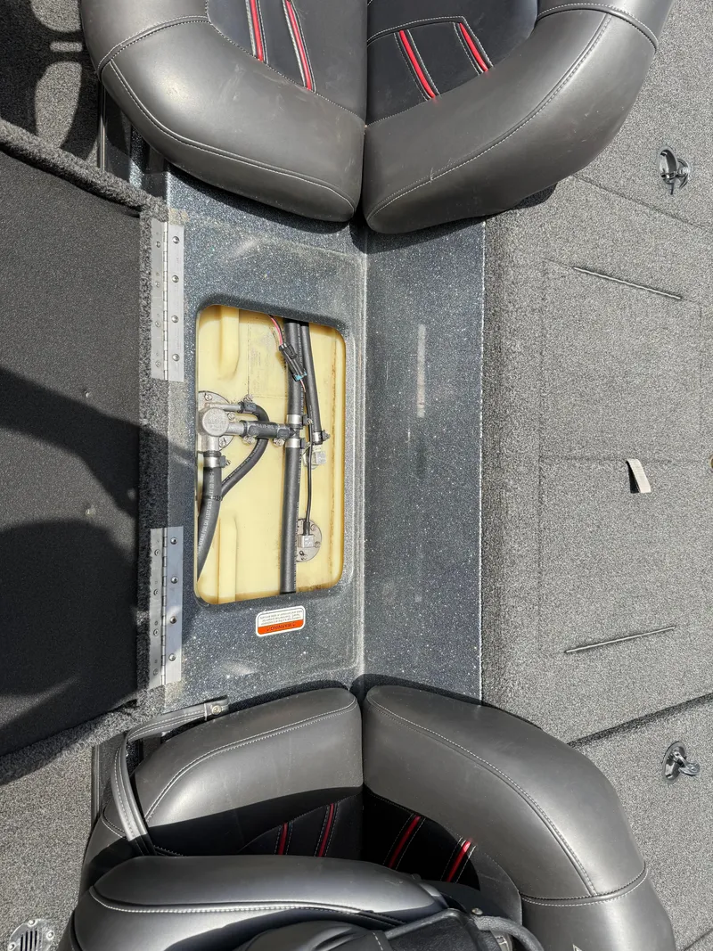 Slide: The Image of Interior view of a 2016 Nitro Z18 boat showing seating and storage compartment. - 16