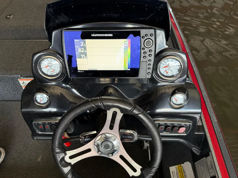 Slide: The Image of Nitro Z18 2016 boat dashboard with Humminbird display and gauges. - 18