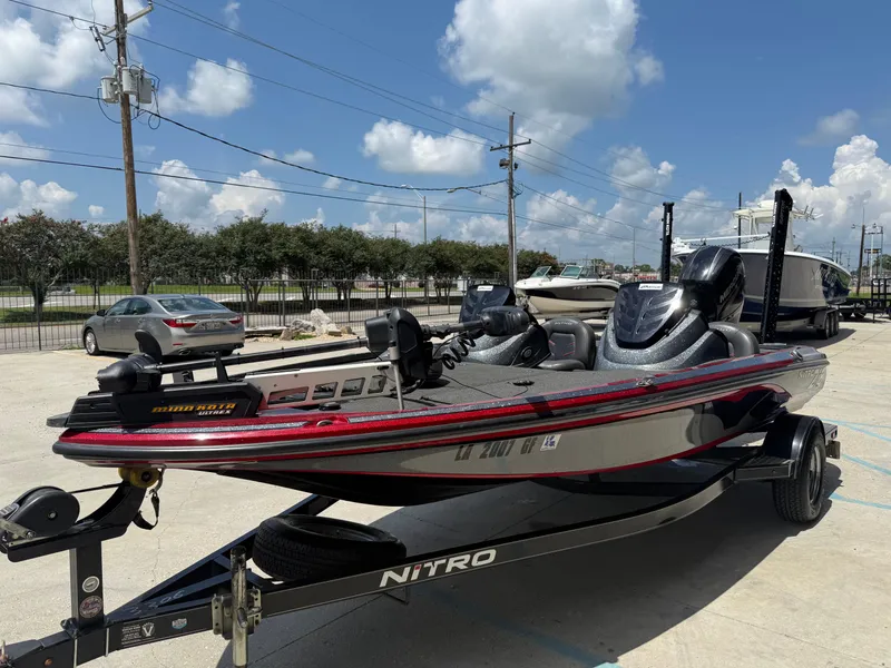 Slide: The Image of 2016 Nitro Z18 boat on trailer under clear blue sky. - 3