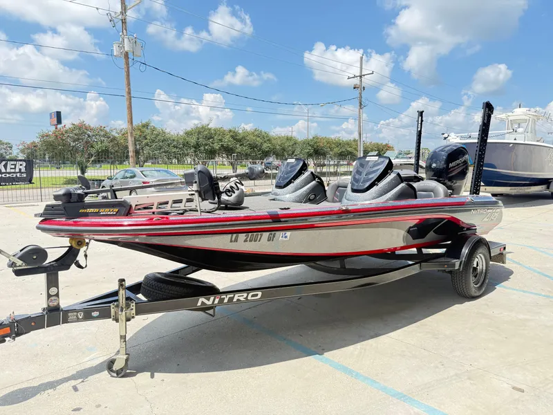 Slide: The Image of 2016 Nitro Z18 boat on trailer under clear blue sky. - 9
