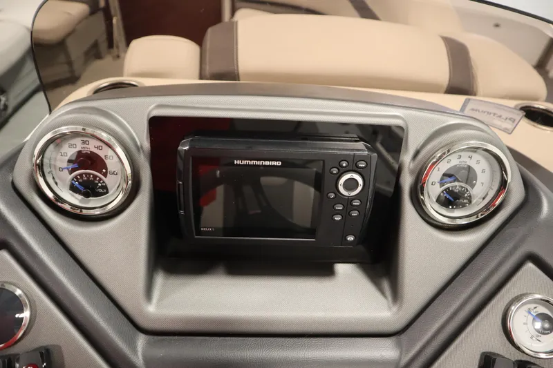 Slide: The Image of Dashboard of 2022 Sylvan 21 L-1 CRS with Humminbird Helix 5 display and gauges. - 14