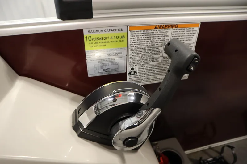 Slide: The Image of Throttle control and capacity warning on 2022 Sylvan 21 L-1 CRS boat. - 17