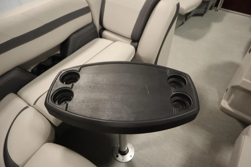 Slide: The Image of Interior of 2022 Sylvan 21 L-1 CRS boat with table and cup holders. - 25