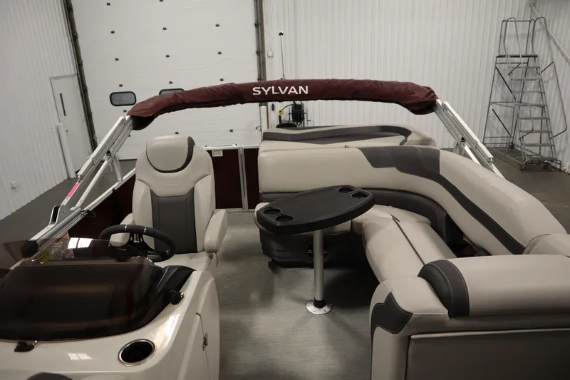 Slide: The Image of 2022 Sylvan 21 L-1 CRS pontoon boat interior with seating and table. - 26