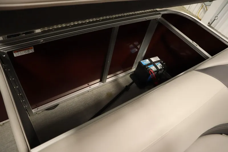 Slide: The Image of Storage compartment of 2022 Sylvan 21 L-1 CRS boat with battery inside. - 28